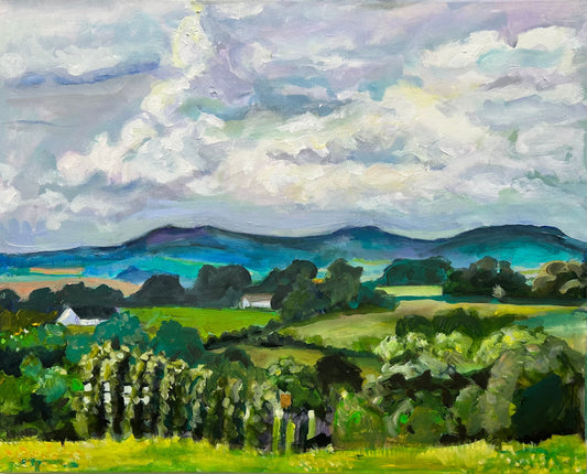 This limited edition print of an original painting by Margaret powell entitled Malvern Hills in  May depicts spring, a large clouds  on a bright but cool day over Malvern Hills. The Hills are in the horizon shown in blue and plenty of green pastures to the foreground different sizes are available to purchase.
