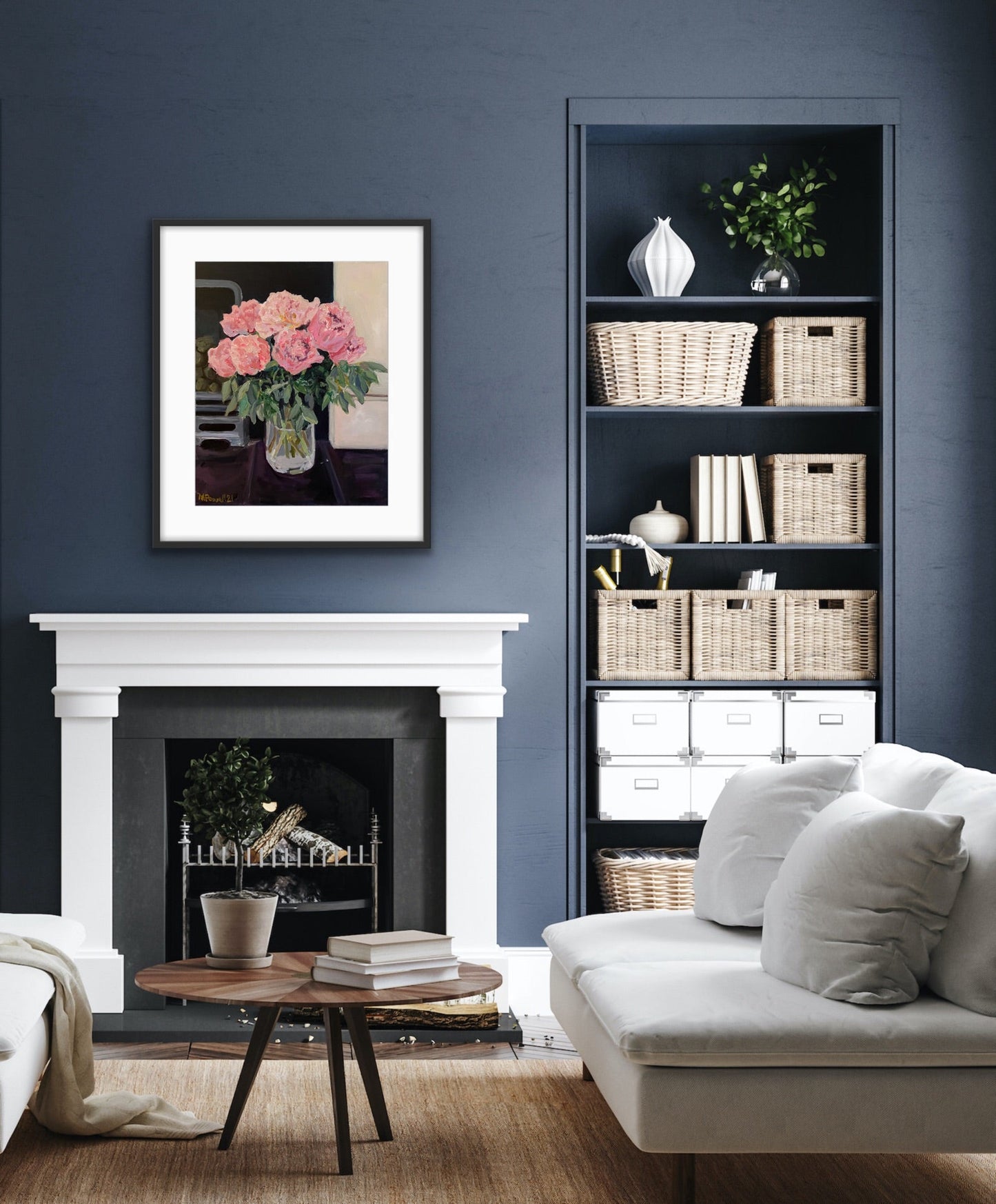 Original painting of Peonies on the Hearth by Margaret Powell, Worcester artist. Displayed in a black frame with white mount against a dark grey wall with white hearth beneath and furniture in foreground.