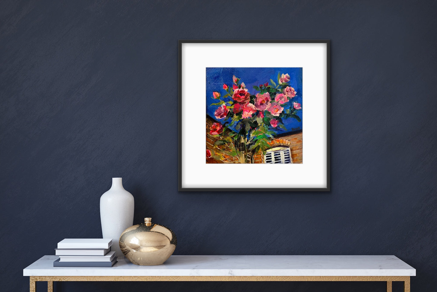 Original fine art painting by Worcester artist Margaret Powell entitled Debbie's Roses displayed against dark blue wall above white shelf