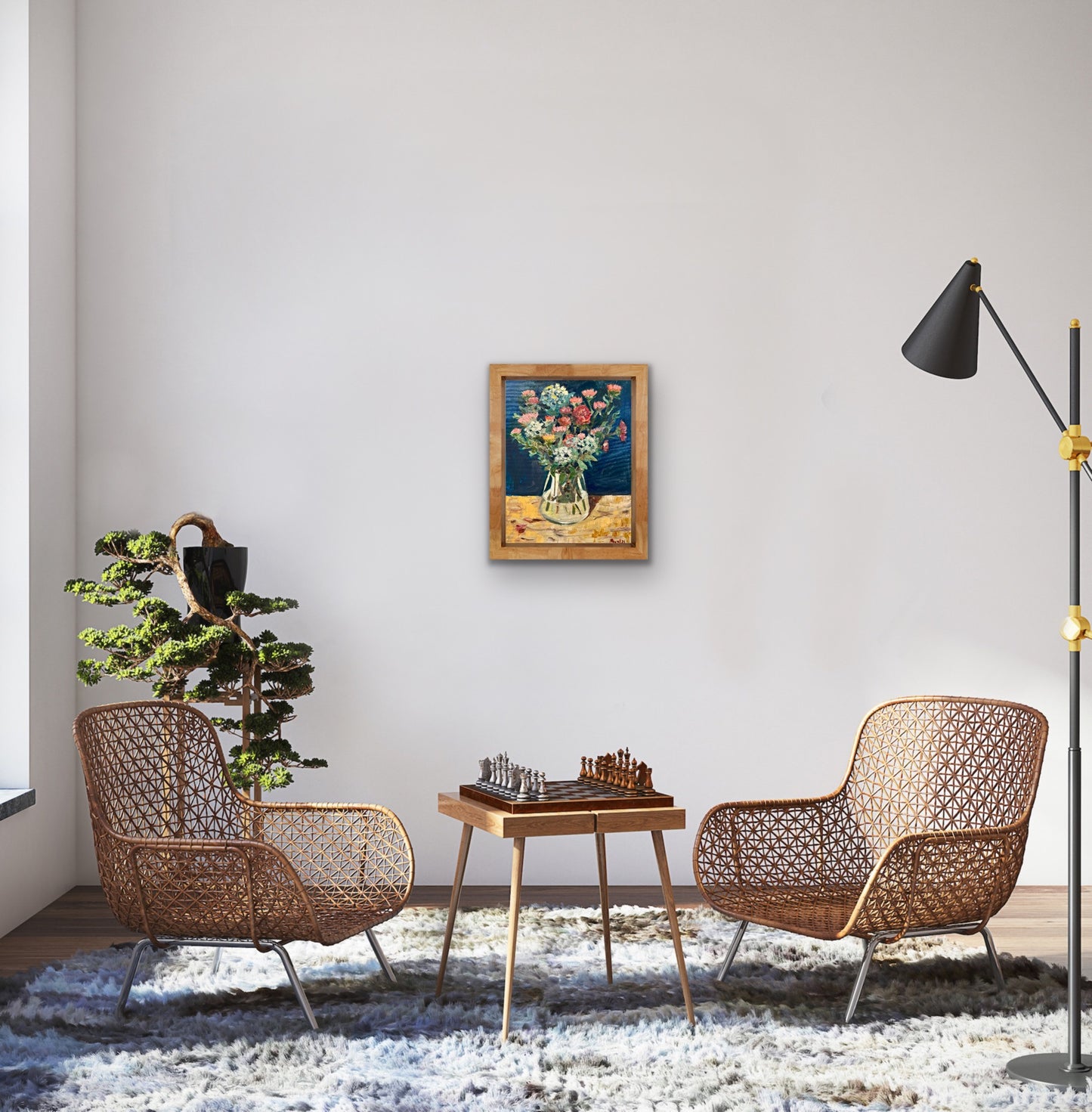 Print of a fine art painting of asters and sedum in a vase by Worcester artist Margaret Powell. Displayed on a white wall with chairs and table in front and chessboard on table.