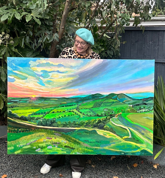 Worcester artist Margaret Powell presents her extra large painting of Dawn at Malvern hills 