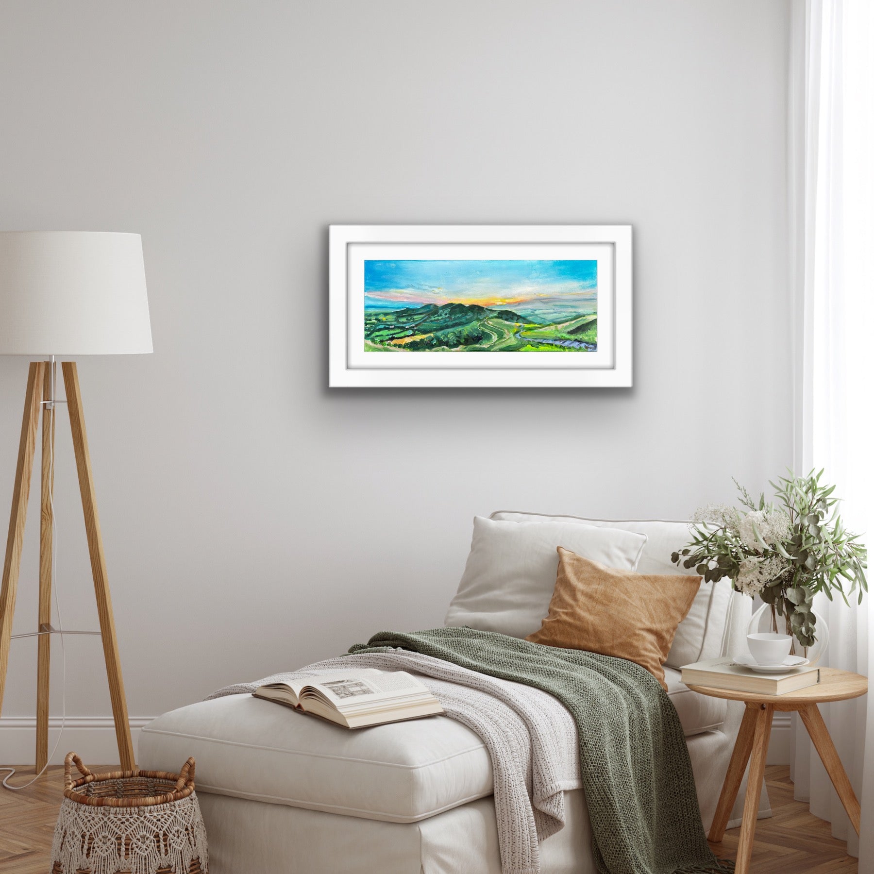 Original painting of Dawn at the Malvern Hills by Worcestershire Artist Margaret Powell displayed in a white frame above a bed
