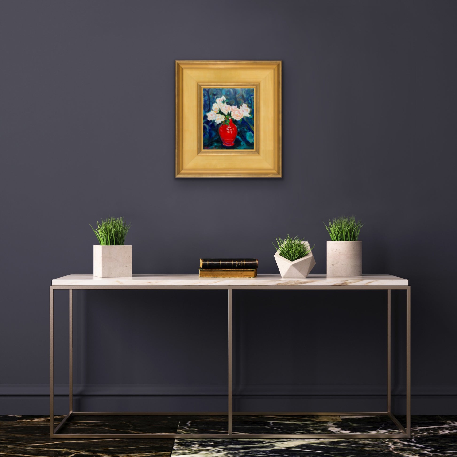 Fine art painting of Blush Roses in a Red Vintage Vase. Displayed against a grey wall with white table in front.