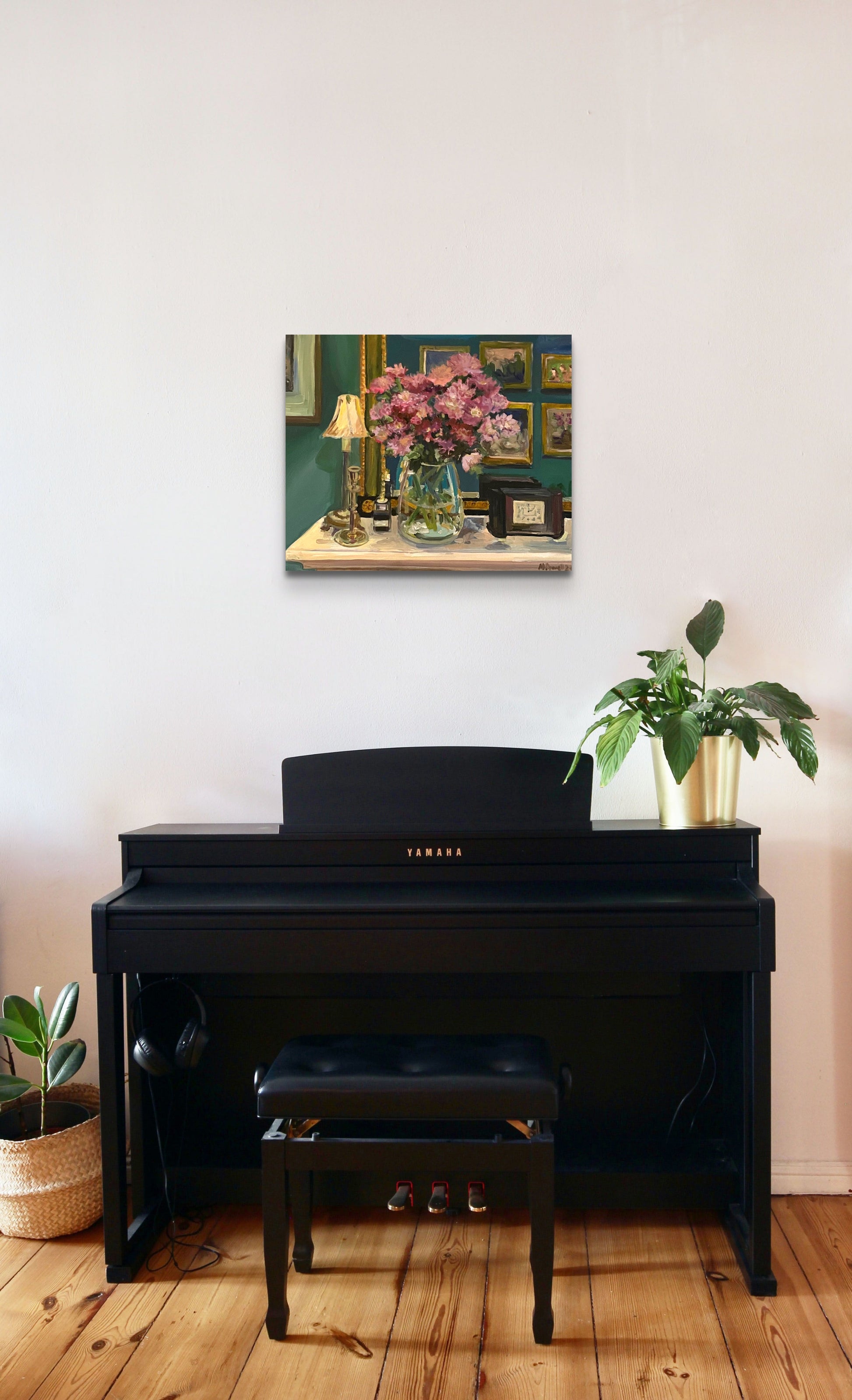Original painting by Worcestershire artist Margaret Powell of Asters in the Dining Room.  Displayed on a white wall behind a black piano with a plant on it.
